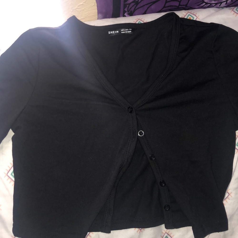 A black button down cropped top